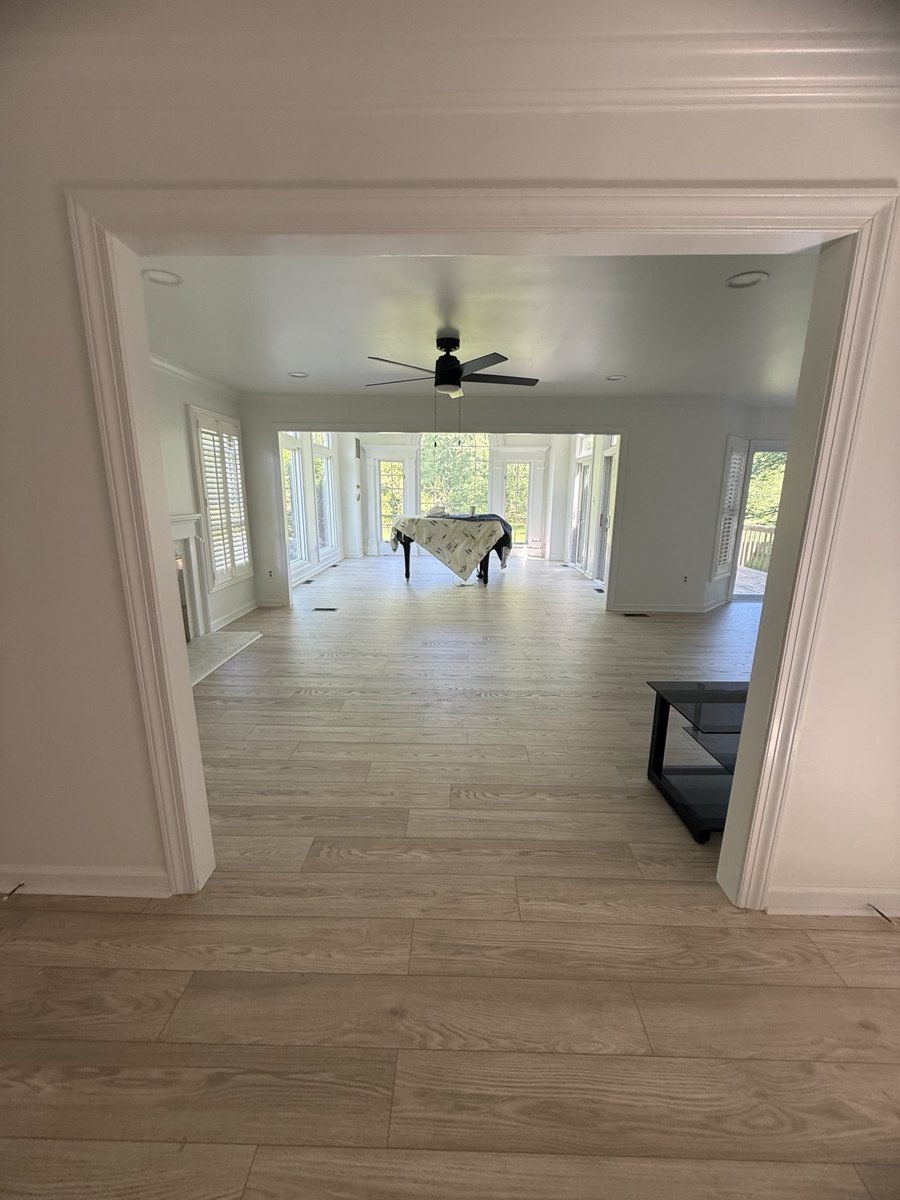 Open living room with new light flooring